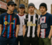 football shirt streetwear 2025 UK – young fans wearing Barcelona, England, Newcastle and PSG replica jerseys in a British urban setting